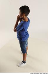 TIMBO STANDING POSE WITH GUN